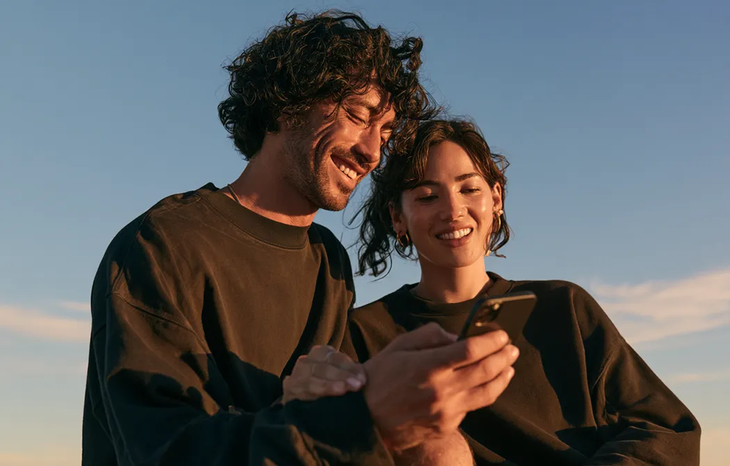 Creative couple working with technology